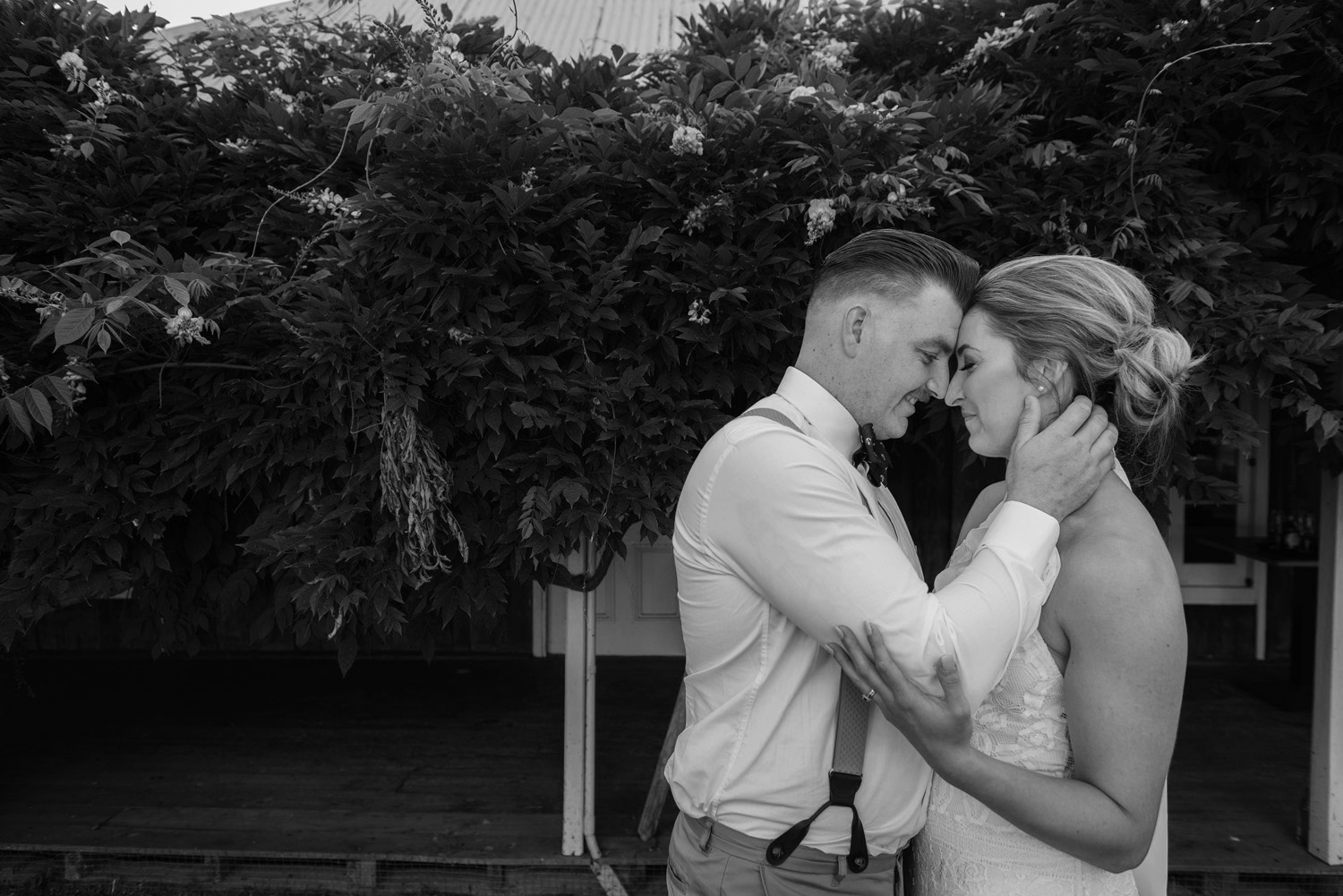 Married couple embracing romantic wedding moment